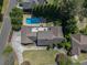 Expansive aerial view of the property, highlighting the pool, spacious backyard, and surrounding neighborhood at 1935 Northbrooke Ln, Atlanta, GA 30338