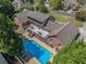 An aerial view showcasing the beautiful house layout, pool, and landscaped backyard at 1935 Northbrooke Ln, Atlanta, GA 30338