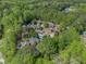 Beautiful aerial view of the property surrounded by lush trees and neighboring homes at 1935 Northbrooke Ln, Atlanta, GA 30338