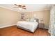 Serene main bedroom featuring a king bed, wood floors, natural light and neutral decor at 1935 Northbrooke Ln, Atlanta, GA 30338