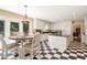 Bright kitchen with black-and-white checkered floor, an island and stainless steel appliances at 1935 Northbrooke Ln, Atlanta, GA 30338