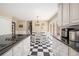 Bright kitchen featuring a checkered floor, stainless steel appliances and natural light at 1935 Northbrooke Ln, Atlanta, GA 30338