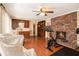 Living area showcases hardwood floors, a brick fireplace and a full kitchen in view at 1935 Northbrooke Ln, Atlanta, GA 30338