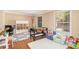 Bright play room features a game table, rug, storage and seating at 1935 Northbrooke Ln, Atlanta, GA 30338