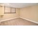 Cozy carpeted room with baseboard trim and a neutral color palette is perfect for a den or guest room at 1935 Northbrooke Ln, Atlanta, GA 30338