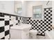 Bathroom with a checker-patterned tiled wall, a vanity sink, and natural lighting at 2480 Warwick Ne Cir, Atlanta, GA 30345
