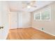 Bedroom with hardwood flooring, ceiling fan, closet, and window view at 2480 Warwick Ne Cir, Atlanta, GA 30345