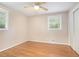 Bedroom featuring hardwood floors, windows, and a closet at 2480 Warwick Ne Cir, Atlanta, GA 30345