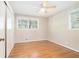 Bedroom with hardwood flooring, ceiling fan, and natural light from window at 2480 Warwick Ne Cir, Atlanta, GA 30345