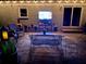 Back patio at night, complete with outdoor lighting and comfortable seating, perfect for entertaining at 2574 Warwick Dr, Marietta, GA 30062