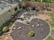 Aerial view of landscaped backyard with stone patio and garden beds, creating a serene outdoor space at 2574 Warwick Dr, Marietta, GA 30062