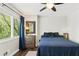 Comfortable bedroom featuring a ceiling fan, window with blinds, and hardwood floors at 2574 Warwick Dr, Marietta, GA 30062