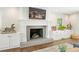 Stylish fireplace with a modern design and built-in cabinets, adding charm and functionality to the living space at 2574 Warwick Dr, Marietta, GA 30062