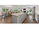 Open-concept kitchen with large island and views of living spaces, with granite countertops at 2574 Warwick Dr, Marietta, GA 30062
