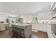Bright kitchen features an island with seating and granite countertops with stainless steel appliances at 2574 Warwick Dr, Marietta, GA 30062