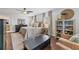Spacious main bedroom with neutral tones, hardwood floors, ceiling fan, and sitting area at 2574 Warwick Dr, Marietta, GA 30062