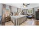 Spacious main bedroom features a ceiling fan, hardwood floors, and large windows at 2574 Warwick Dr, Marietta, GA 30062