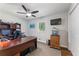 Well-lit office space featuring a large desk, storage, and a window providing natural light at 2574 Warwick Dr, Marietta, GA 30062