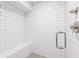 Modern shower with white subway tile, glass door, and built-in bench, offering a spa-like experience at 2574 Warwick Dr, Marietta, GA 30062
