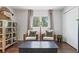 Cozy sitting area with wicker chairs, hardwood floors, and natural light from windows at 2574 Warwick Dr, Marietta, GA 30062