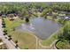 Aerial view of a pond surrounded by trees and walking path at 4650 Brighton View Trl, Cumming, GA 30040