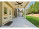 Covered back patio with ceiling fan and backyard access at 4650 Brighton View Trl, Cumming, GA 30040