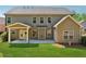 Expansive backyard with a covered patio, lush lawn, and well-maintained landscaping, ideal for outdoor living at 4650 Brighton View Trl, Cumming, GA 30040