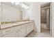 Granite countertop and dual vanity with a tiled shower/tub combo in this modern bathroom at 4650 Brighton View Trl, Cumming, GA 30040