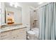 Bright bathroom featuring granite countertops, tub shower, tile floors, and fresh fixtures at 4650 Brighton View Trl, Cumming, GA 30040