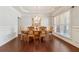 Elegant dining room with hardwood floors, tray ceiling, chandelier, and traditional furniture, perfect for Gathering gatherings at 4650 Brighton View Trl, Cumming, GA 30040