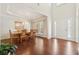 Elegant dining room with hardwood floors, tray ceiling, chandelier, and traditional furniture, perfect for Gathering gatherings at 4650 Brighton View Trl, Cumming, GA 30040