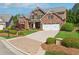Beautiful two-story brick home featuring a well-manicured lawn and attached two-car garage at 4650 Brighton View Trl, Cumming, GA 30040