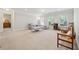 Bright living room featuring many windows, a ceiling fan, and simple furnishings at 4650 Brighton View Trl, Cumming, GA 30040