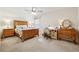 Cozy bedroom with a bed, desk, ceiling fan and natural light at 4650 Brighton View Trl, Cumming, GA 30040