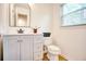 Bright bathroom with a stylish vanity, modern fixtures, and a separate toilet area at 4992 Meadow Ln, Marietta, GA 30068