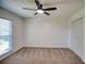 Bedroom with carpet floors, ceiling fan and natural light from window at 4992 Meadow Ln, Marietta, GA 30068