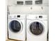 Convenient laundry area with modern front-load washer and dryer at 4992 Meadow Ln, Marietta, GA 30068