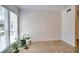 Bright living room featuring tiled flooring and natural light from a large window at 4992 Meadow Ln, Marietta, GA 30068