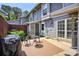 Cozy patio with a grill, seating and decor with a view of the home's exterior at 4992 Meadow Ln, Marietta, GA 30068
