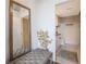 Bathroom with a bench and a mirror that leads to a toilet and sink at 3235 Roswell Ne Rd # 721, Atlanta, GA 30305