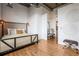 Well-lit bedroom featuring hardwood floors and modern decorations, with an ensuite bathroom at 3235 Roswell Ne Rd # 721, Atlanta, GA 30305