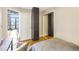 Bedroom with hardwood floors, sliding closet and open doorway to living spaces at 3235 Roswell Ne Rd # 721, Atlanta, GA 30305