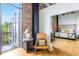 Bedroom featuring exposed brick, and hardwood floors with a private outdoor balcony at 3235 Roswell Ne Rd # 721, Atlanta, GA 30305