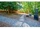 Community dog park features a gravel path, grassy area, and waste station at 3235 Roswell Ne Rd # 721, Atlanta, GA 30305