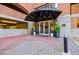 Entrance to Buckhead Village Lofts with landscaped flower pots and black awning at 3235 Roswell Ne Rd # 721, Atlanta, GA 30305