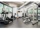 Well-equipped fitness center with cardio machines, weightlifting equipment, and natural light at 3235 Roswell Ne Rd # 721, Atlanta, GA 30305