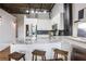Modern kitchen with stainless steel appliances, granite countertops, and breakfast bar at 3235 Roswell Ne Rd # 721, Atlanta, GA 30305