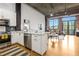 Open kitchen featuring stainless steel appliances, granite countertops, and exposed brick at 3235 Roswell Ne Rd # 721, Atlanta, GA 30305