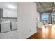 Laundry area featuring white washer and dryer, white cabinets and hardwood floors at 3235 Roswell Ne Rd # 721, Atlanta, GA 30305