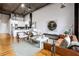 Spacious living room featuring exposed brick, concrete ceiling, and a modern kitchen at 3235 Roswell Ne Rd # 721, Atlanta, GA 30305
